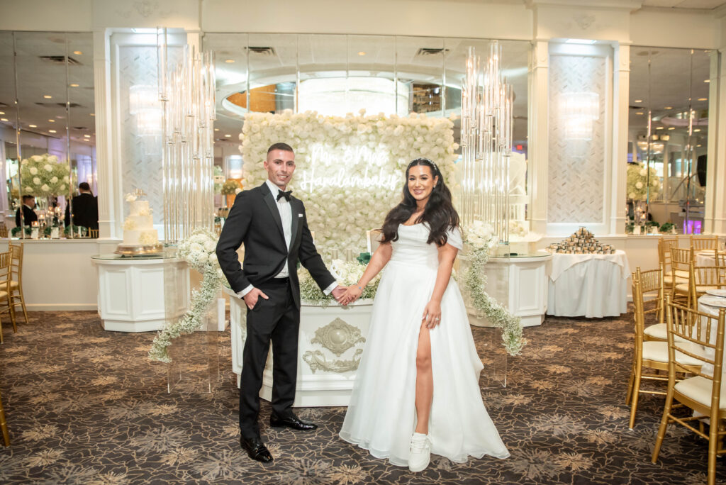 greek wedding couple standing in front of sweetheart table modern classic elegant classy at the greycliff in moonachie new jersey